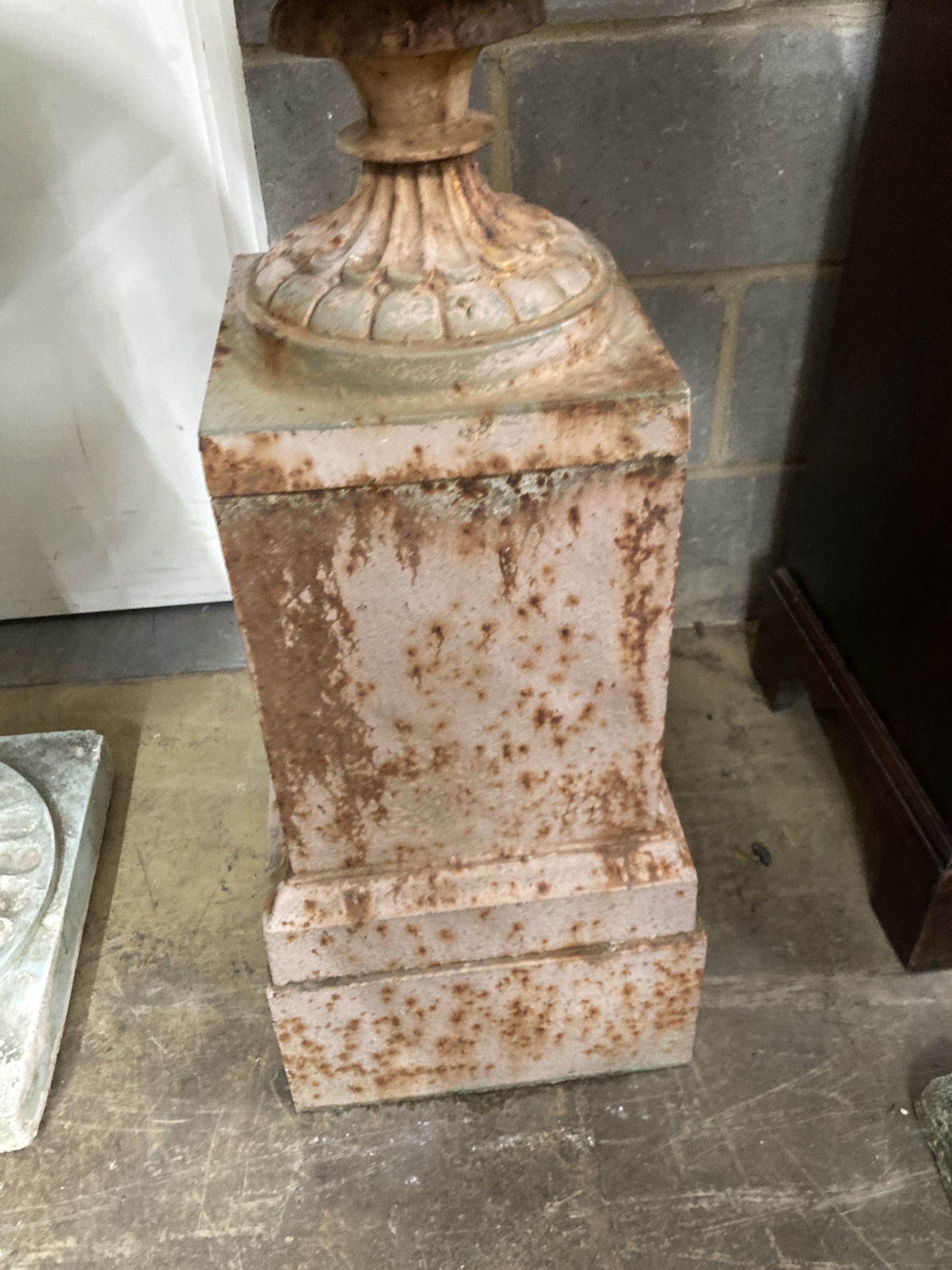 A Victorian style cast iron campana garden urn on stand, diameter 52cm, height 97cm